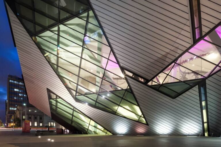 An interior view of the Royal Ontario Museum displaying a mix of art, cultural artifacts, and natural history exhibits.