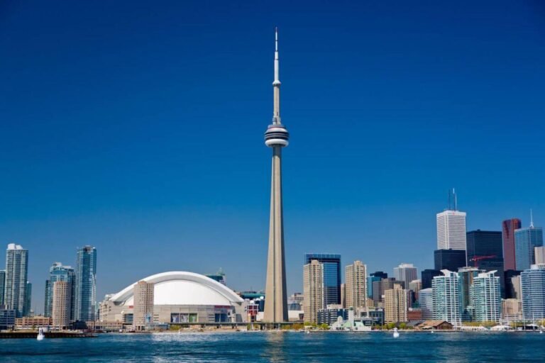 A panoramic view of Toronto's skyline from the CN Tower, highlighting its famous observation decks and revolving restaurant.