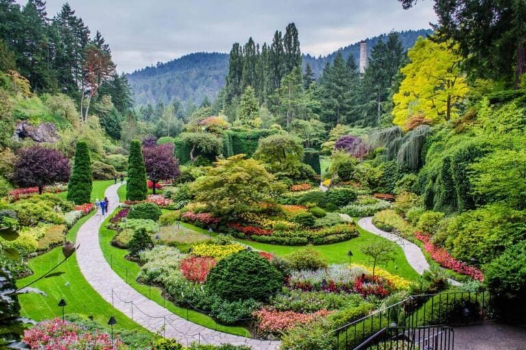 Butchart Gardens with colorful flowers, themed areas, and a vibrant fireworks display